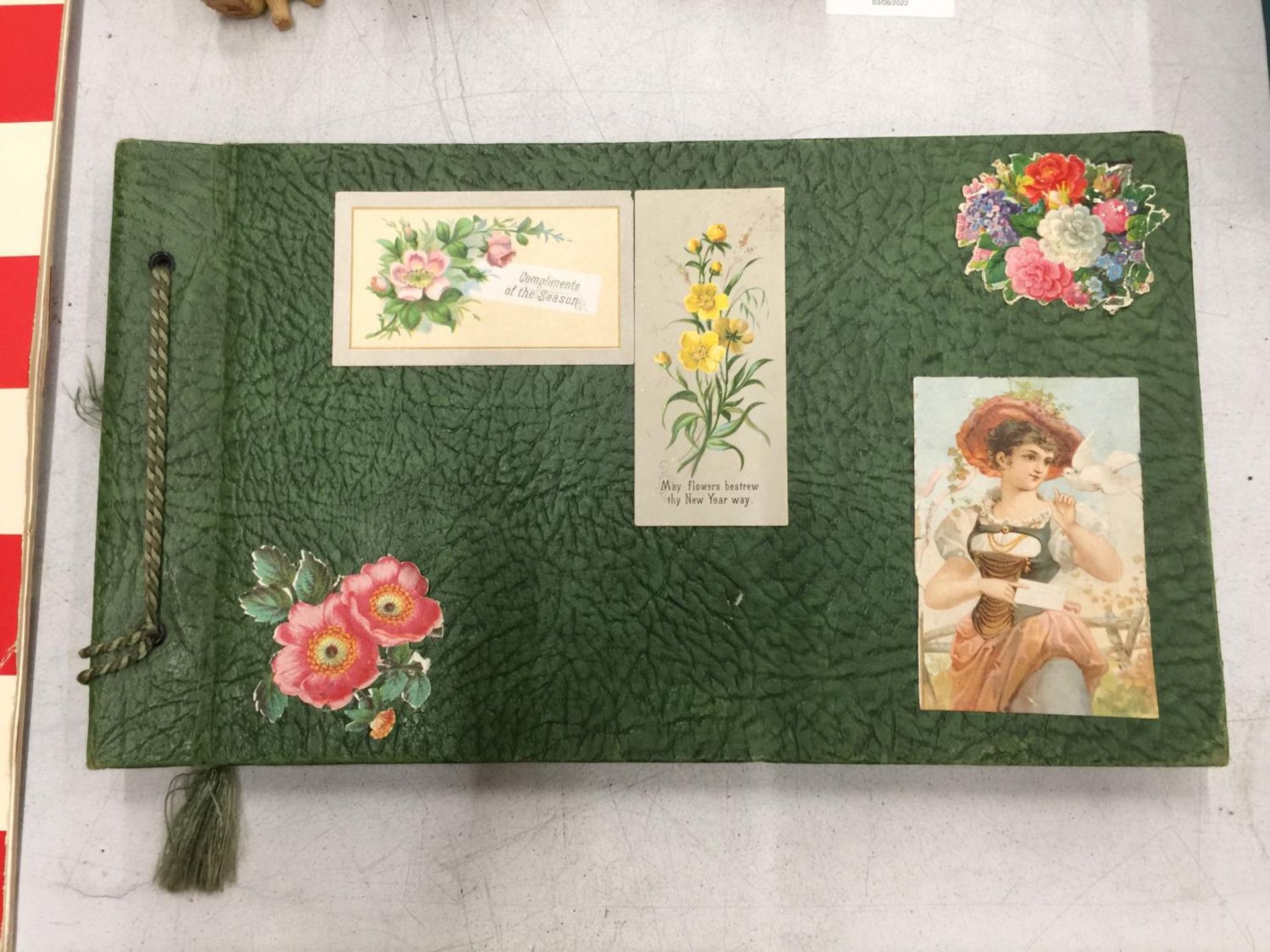 A VINTAGE SCRAPBOOK FILLED WITH VICTORIAN IMAGES