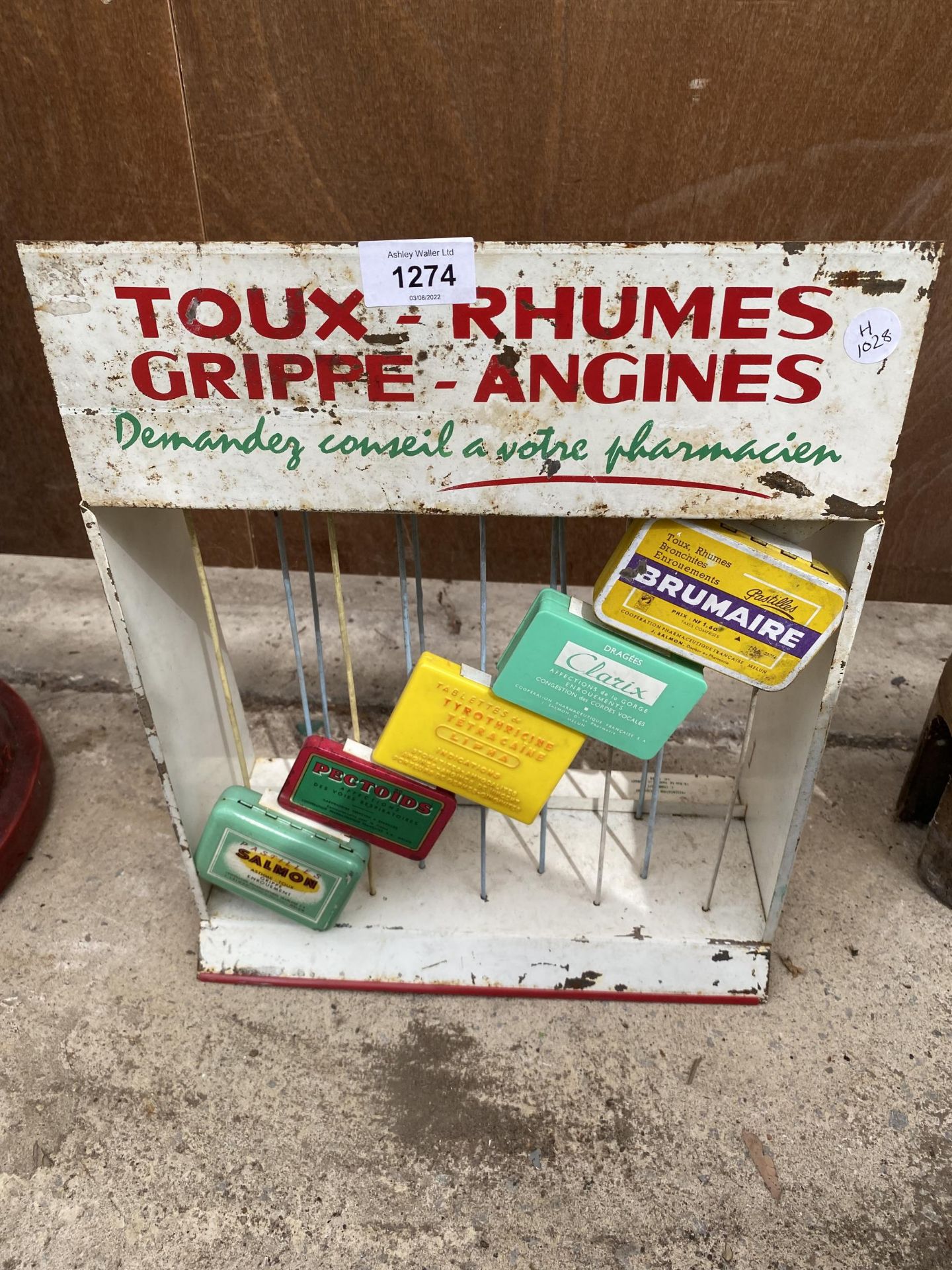 A VINTAGE CONTINENTAL 'TOUX RHUMES' ADVERTISEMENT SHOP