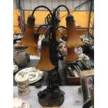 AN ART NOUVEAU STYLE TABLE LAMP WITH SIX BRANCHES AND AMBER GLASS SHADES - WORKING AT TIME OF