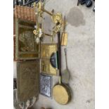 AN ASSORTMENT OF METALWARE ITEMS TO INCLUDE BRASS PLAQUES, FIRE DOGS AND TOASTING FORKS ETC