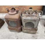 A PAIR OF VINTAGE GALVANISED PARAFIN LAMPS