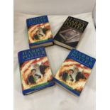 FOUR HARRY POTTER 1ST EDITION BOOKS TO INCLUDE ONE WITH A MISPRINT ERROR ON PAGE 99 WHERE THE WORD