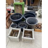 A VERIETY OF GARDEN POTS AND PLANTERS