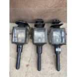 THREE VINTAGE PARAFIN POWERED COACH LAMPS