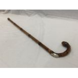 A SILVER TOPPED WALKING CANE MARKED H.S. GUARDS CLUB AND CONSEALED HORSE MEASURING STICK A/F