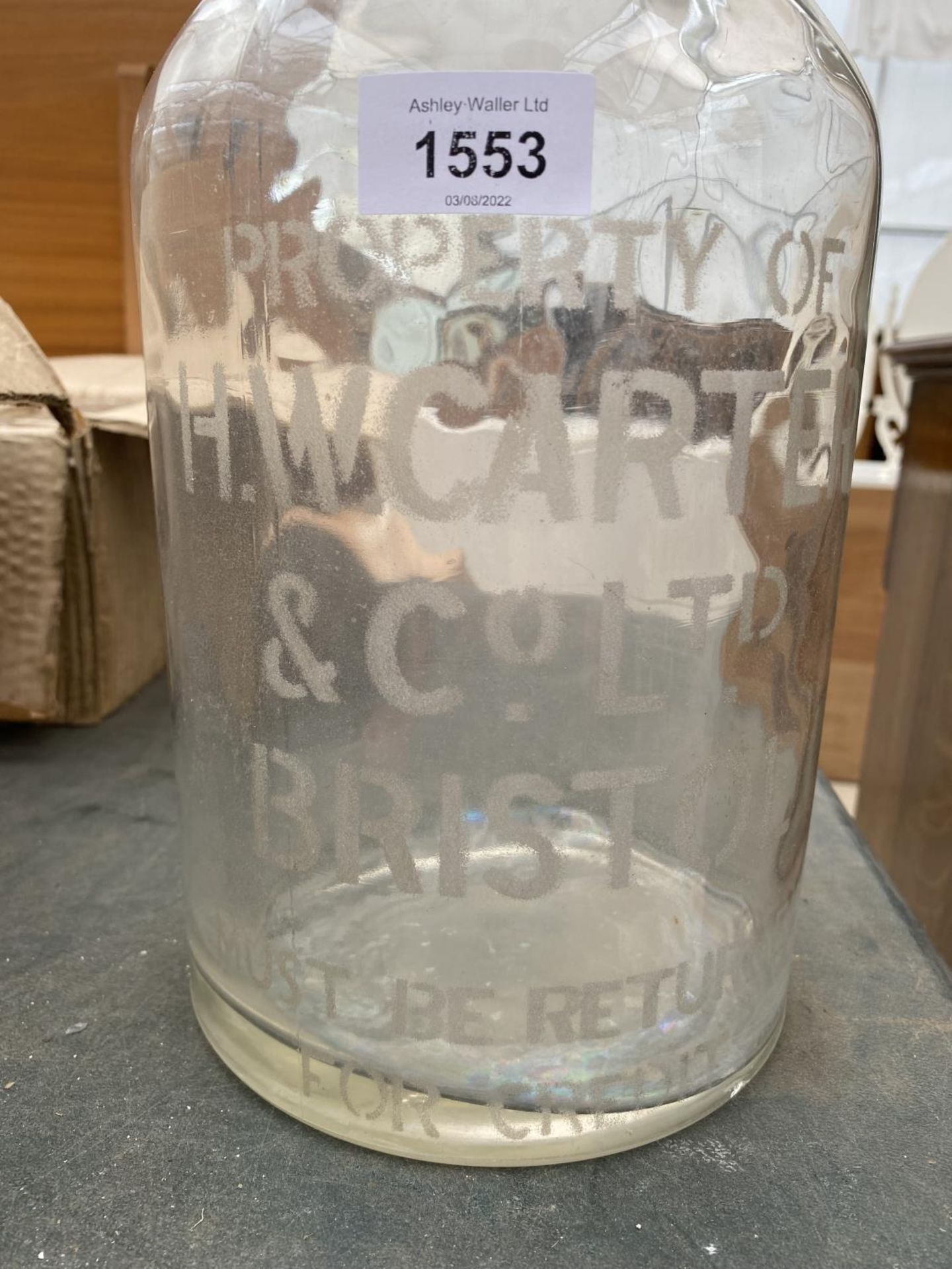 A VINTAGE GLASS BOTTLE WITH CORK AND STAMPED 'H.W.CARTER & CO LTD BRISTOL' - Image 2 of 2