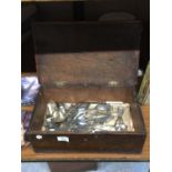 A VINTAGE MAHOGANY BOX CONTAINING AN AMOUNT OF VINTAGE FLATWARE