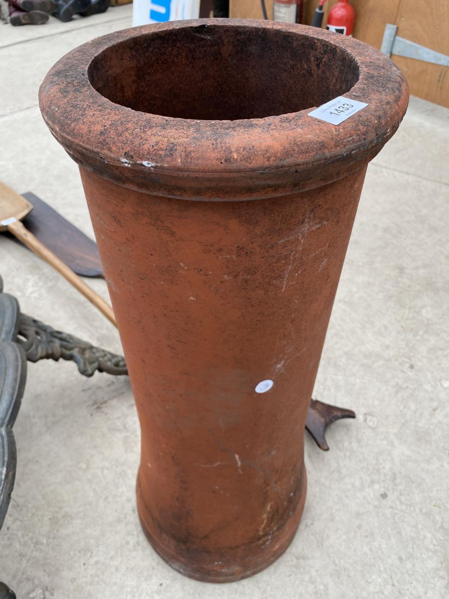 A VINTAGE ROUND TERRACOTTA CHIMNEY POT