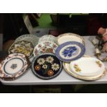 A QUANTITY OF WALL HANGING PLATES PLUS LARGE SERVING PLATES