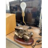 A DECORATIVE TABLE LAMP WITH VINTAGE CAR DESING