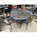 A CAST ALLOY BISTRO SET COMPRISING OF A ROUND TABLE AND FOUR CHAIRS