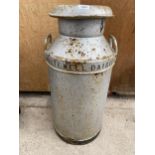 A VINTAGE GALVANISED MILK CHURN WITH LID BEARING THE NAME 'WHITE WELL DARIES ACCRINGTON'