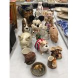 A QUANTITY OF CERAMIC ITEMS TO INCLUDE PIGS, MICKEY MOUSE, DOGS, MONEY BOXES, ETC