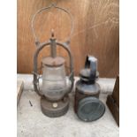 A VINTAGE ROAD LAMP AND A VINTAGE PARAFIN LAMP