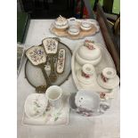A 'PETIT POINT' TRAY, BRUSHES AND MIRROR SET WITH BACK EMBROIDERY PLUS THREE DRESSING TABLE SETS