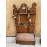 A VINTAGE WOODEN KITCHEN UTENSIL WALL MOUNTED RACK