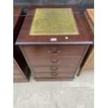 A MAHOGANY TWO DRAWER FILING CABINET WITH INSET LEATHER TOP