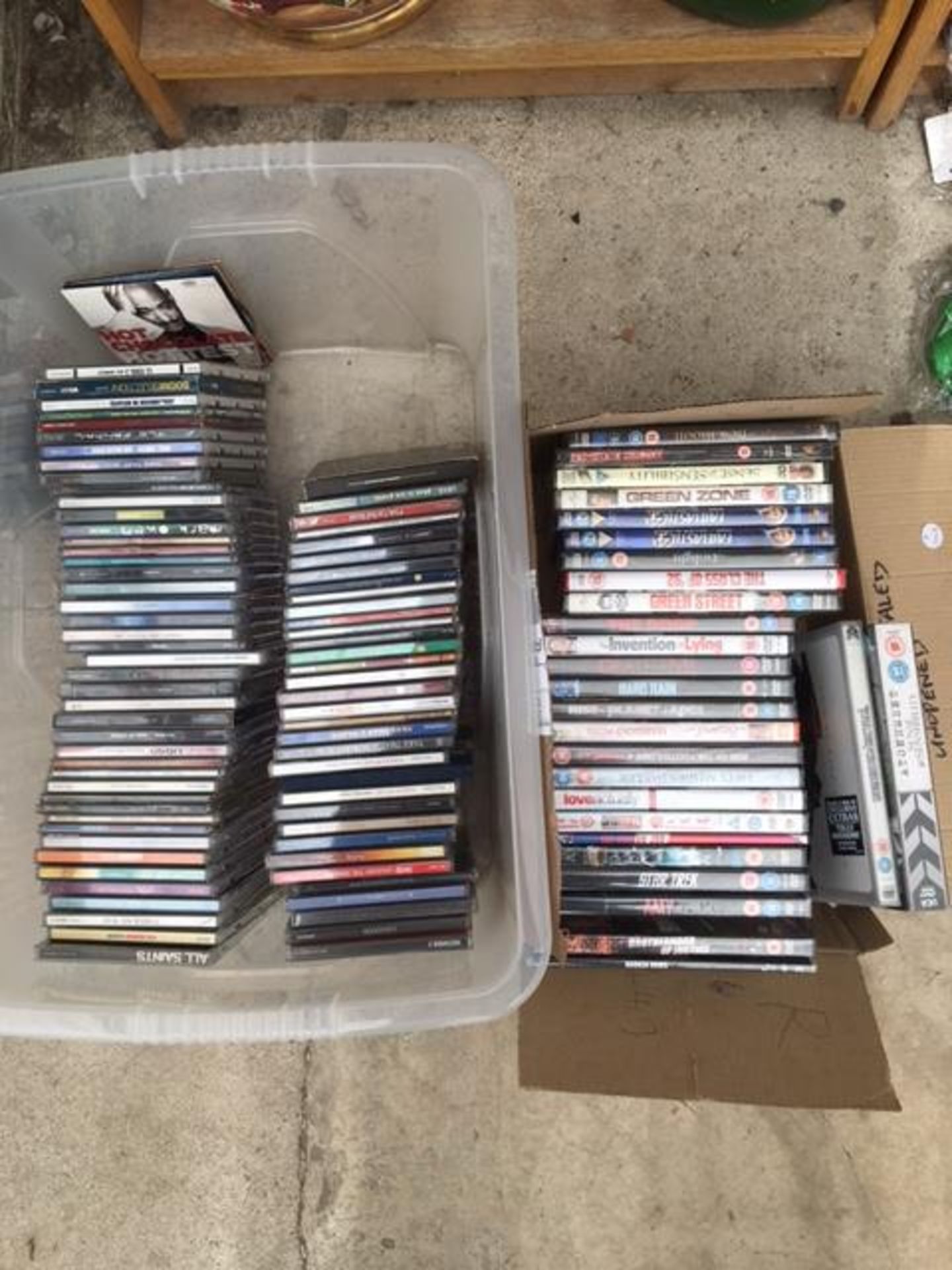 AN ASSORTMENT OF CDS AND DVDS