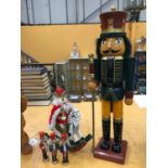 A COLLECTION OF NUTCRACKER FIGURES TO INCLUDE A VERY LARGE GUARD (61CM), A KING RIDING A ROCKING
