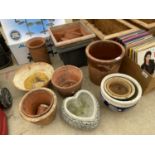 AN ASSORTMENT OF VARIOUS CERAMIC AND GLAZED PLANTERS AND POTS
