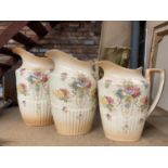 THREE BLUSH IVORY JUGS BY CROWN DEVON IN GRADUATING SIZES