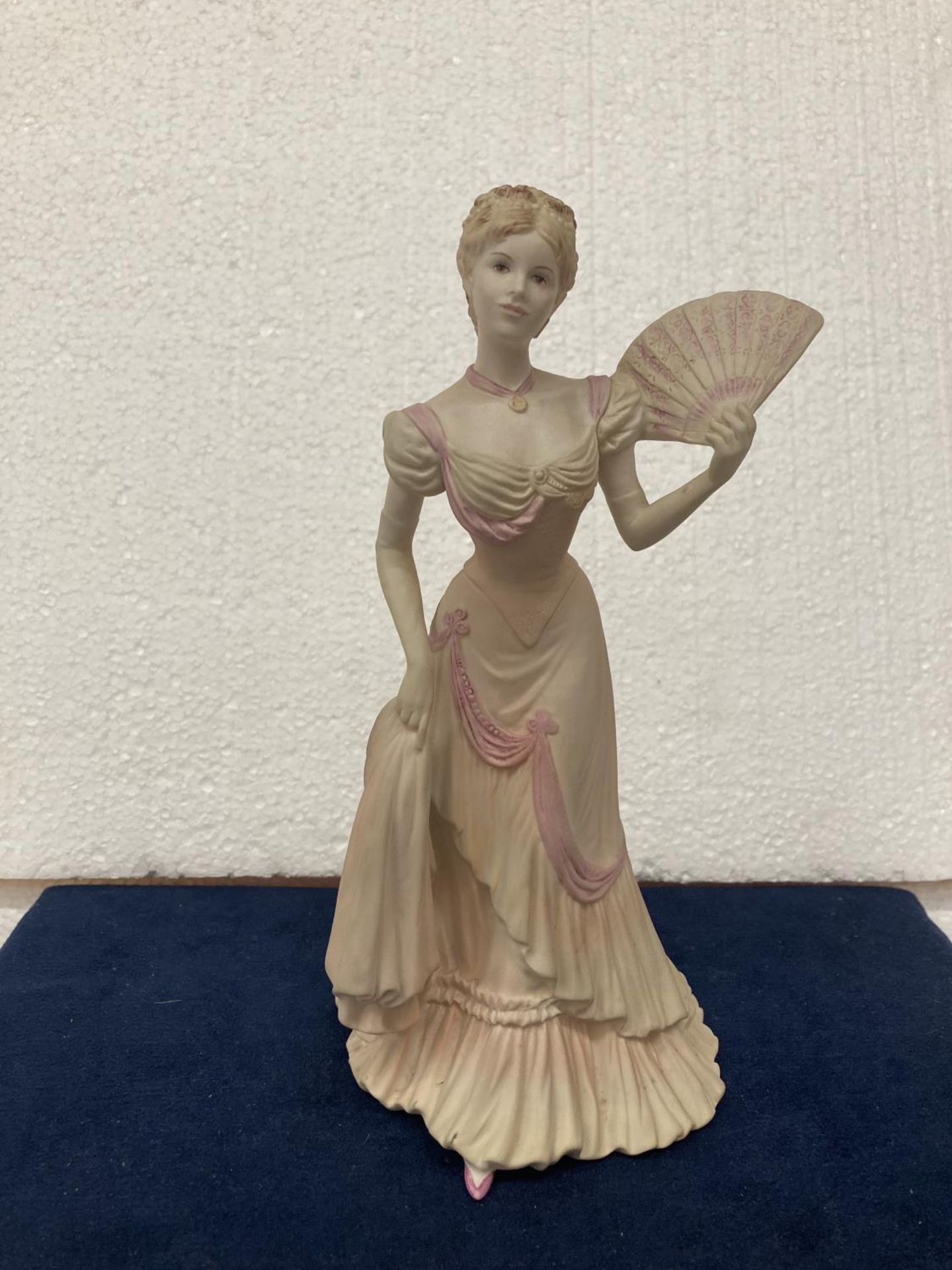 A COALPORT PORCELAIN FIGURINE FROM THE AGE OF ELEGANCE COLLECTION "EVENING AT THE OPERA" HAND