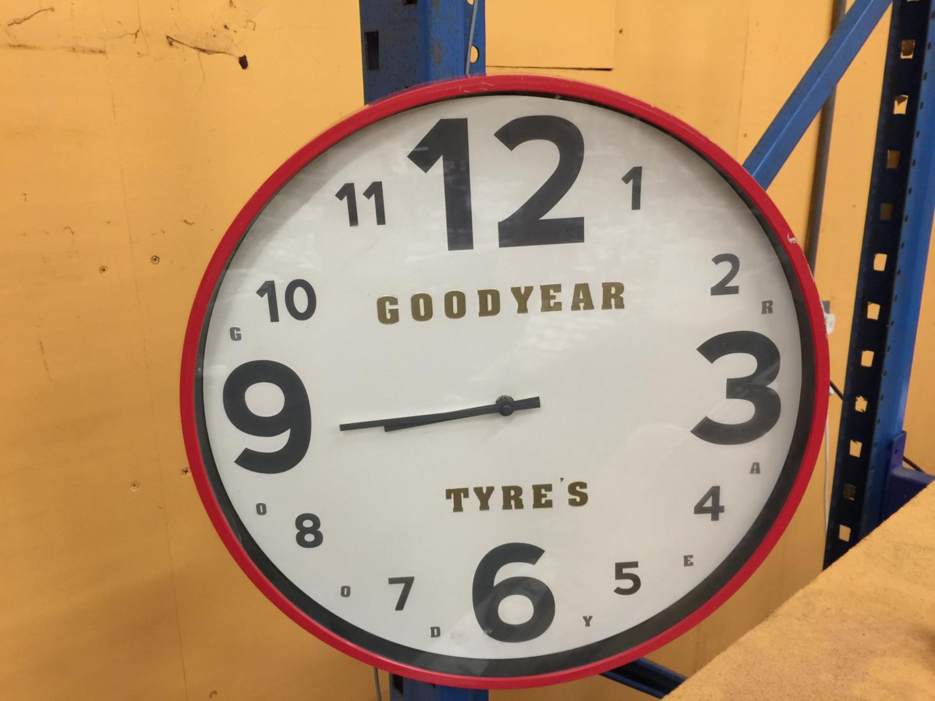 A LARGE GOODYEAR TYRES WALL CLOCK DIAMETER APPROX 46CM