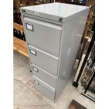 A SILVERLINE FOUR DRAWER FILING CABINET WITH KEY
