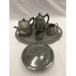 A HAND HAMMERED SIX PIECE TUDRIC PEWTER SET