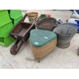 TWO GALVANISED COAL BUCKETS, A WOODEN WHEEL BARROW PLANTER AND A SEWING BASKET