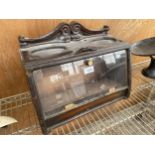 A VINTAGE WOODEN CIGAR CABINET WITH HINGED FRONT DOOR