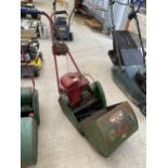 A VINTAGE SUFFLOCK COLT SELF PROPELLED LAWN MOWER WITH GRASS BOX