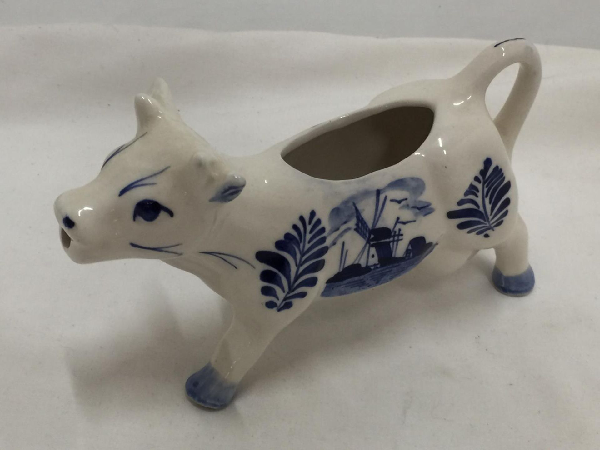 A DELFT BLUE HANDPAINTED COW CREAMER AND A JERSEY COW CREAMER - Image 3 of 7