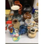 A COLLECTION OF VASES AND JUGS TO INCLUDE STONEWARE AND TREACLE GLAZE