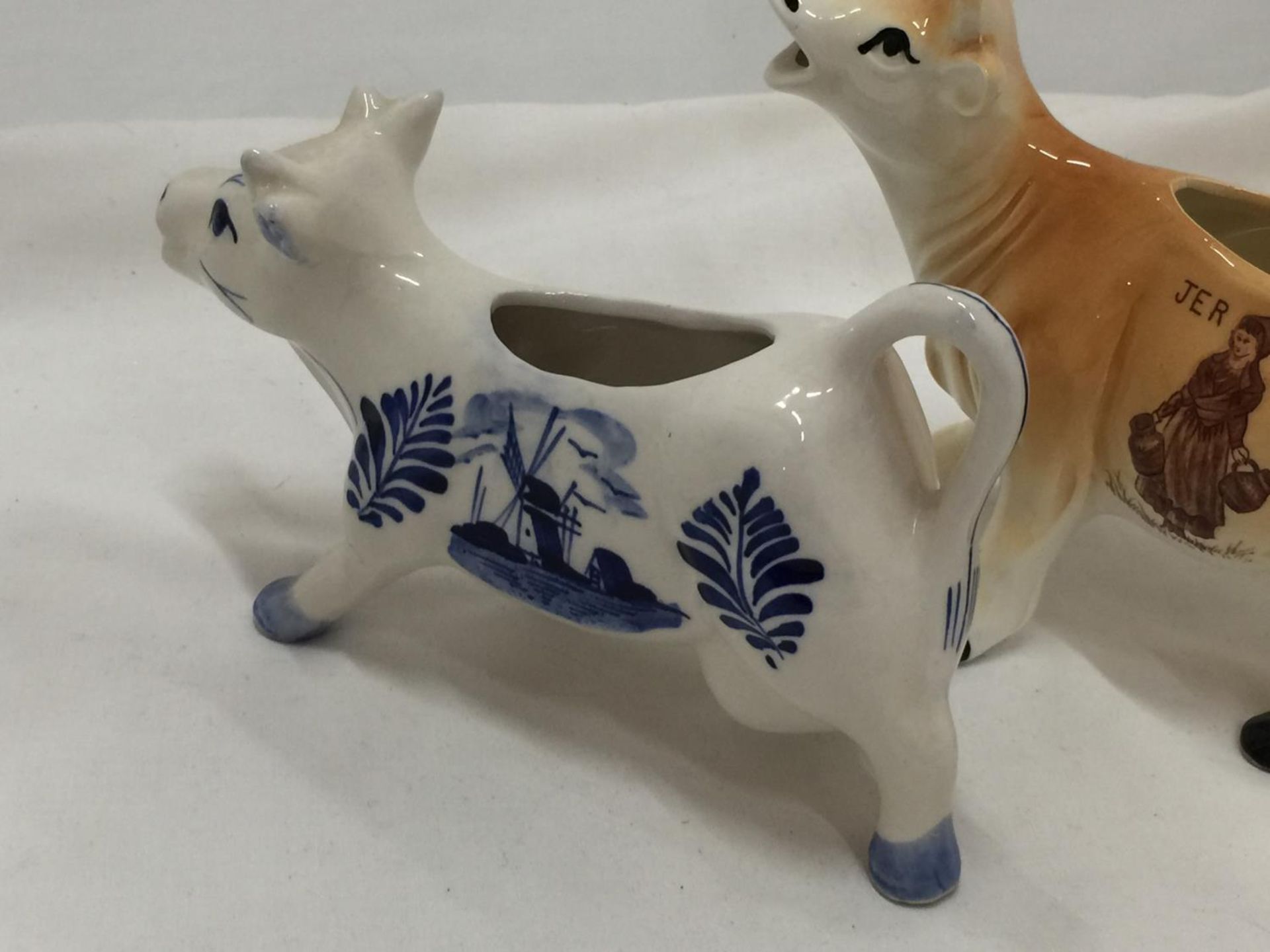 A DELFT BLUE HANDPAINTED COW CREAMER AND A JERSEY COW CREAMER - Image 5 of 7