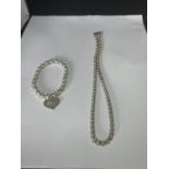 A MARKED SILVER BALL DESIGN NECKLACE AND BRACELET WITH A HEART DESIGN CHARM