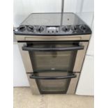 A BLACK ZANUSSI FREESTANDING ELECTRIC OVEN AND HOB BELIEVED IN WORKING ORDER BUT NO WARRANTY