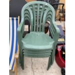 FOUR GREEN PLASTIC STACKING GARDEN CHAIRS