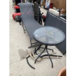 AN ASSORTMENT OF GARDEN FURNITURE TO INCLUDE A SUN LOUNGER AND TWO TABLES ETC