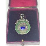 A MARKED SILVER MEDAL IN A PRESENTATION BOX