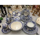 A QUANTITY OF EMPIRE 'OLD WILLOW' PATTERN TO INCLUDE CUPS, SAUCERS, BOWLS, SERVING PLATE SAUCE JUGS,