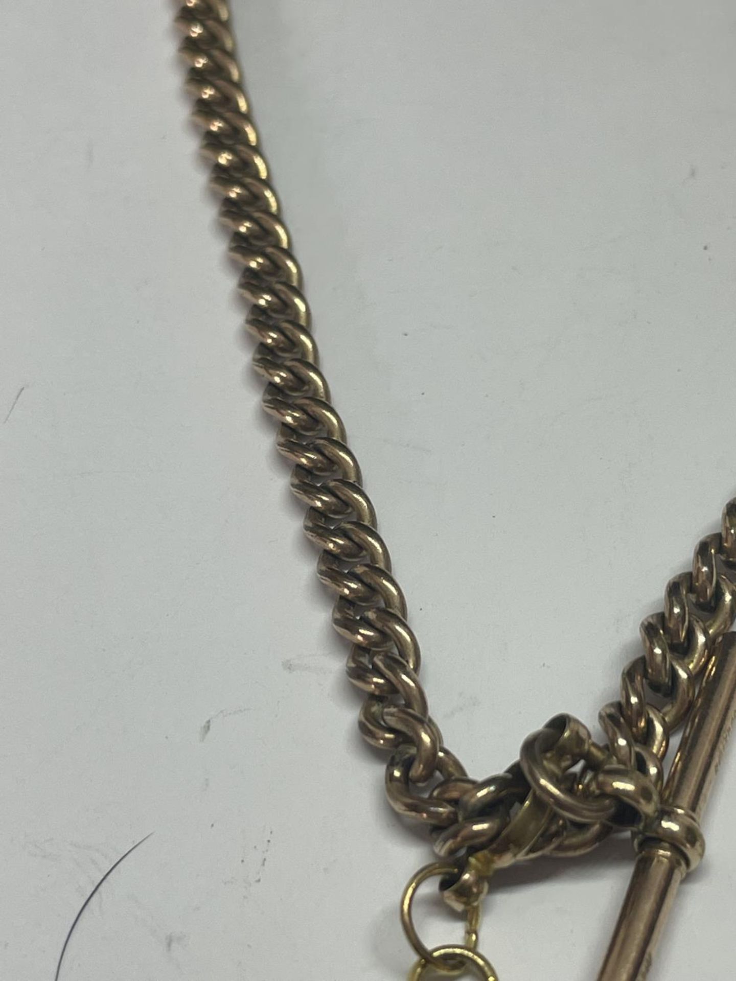 A GOLD PLATED DOUBLE ALBERT WTACH CHAIN WITH T BAR AND FOB - Image 3 of 3