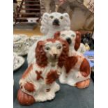 A PAIR OF RED AND WHITE STAFFORDSHIRE MANTLE DOGS HEIGHT 18CM PLUS TWO WHITE ONES HEIGHT 24CM