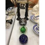 THREE GLASS PAPERWEIGHTS, ONE LIMITED EDITION 566/1500 SIGNED PLUS A PAIR OF BLACK CANDLESTICKS