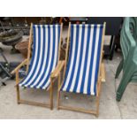 A PAIR OF RETRO WOODEN FRAMED FOLDING DECK CHAIRS