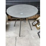 A SMALL ROUND METAL BISTRO TABLE