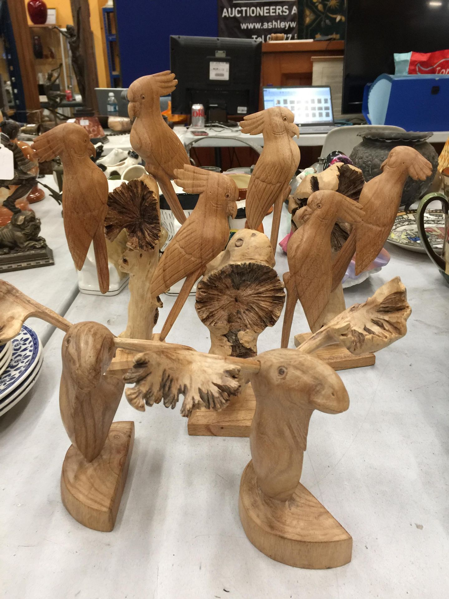 A COLLECTION OF CARVED TREEN PARROTS AND MOOSES - 5 IN TOTAL