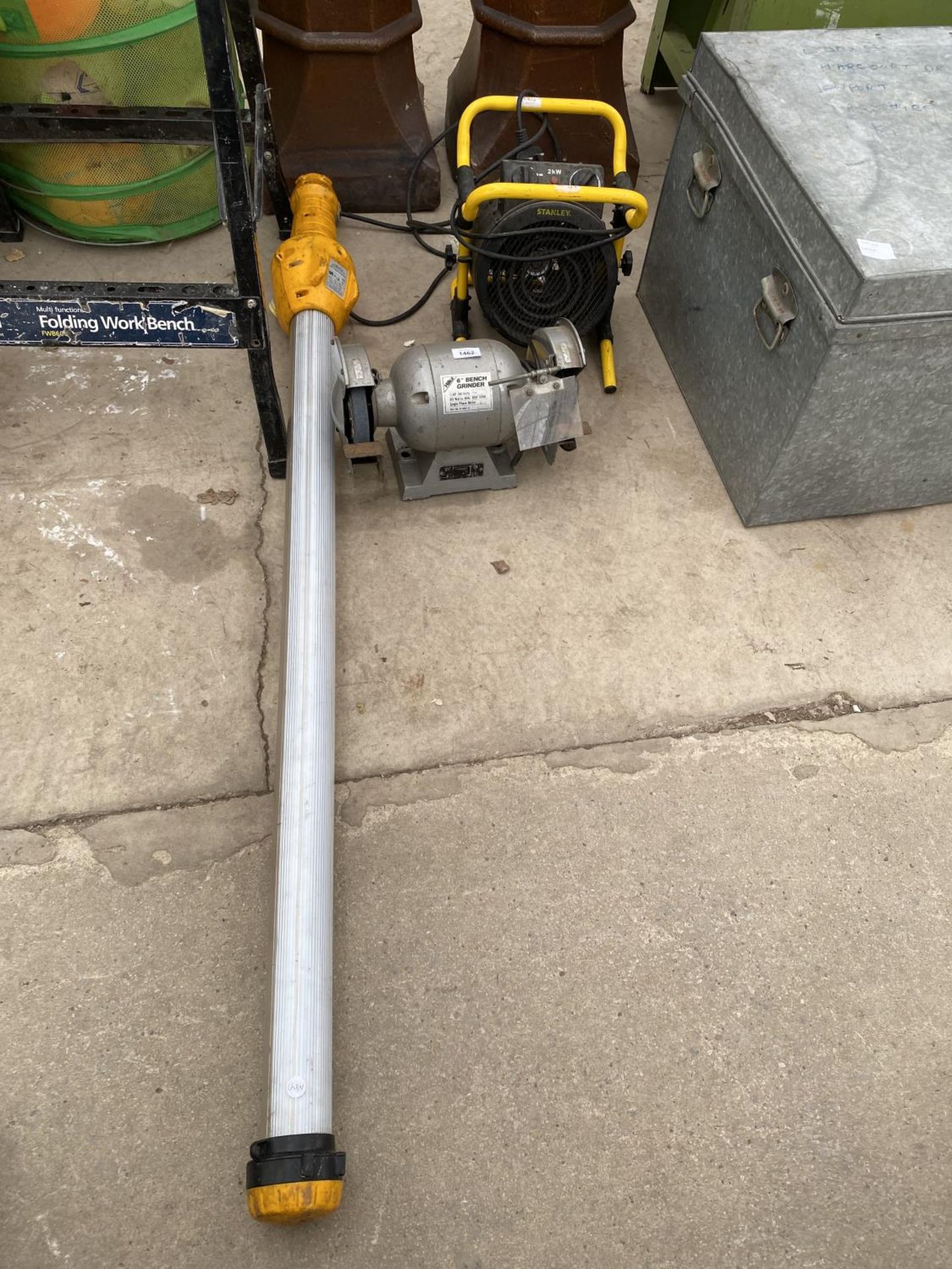 A HLKA 6" BENCH GRINDER, A STANLEY HEATER AND A WORK LIGHT