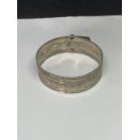 A MARKED SILVER BANGLE IN A BELT DESIGN