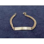 A SILVER ID BRACELET ON A CURB LINK CHAIN